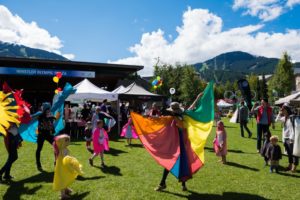 Woman in Colourful Cape at Whistler Children's Festival Event at Whistler Olympic Plaza