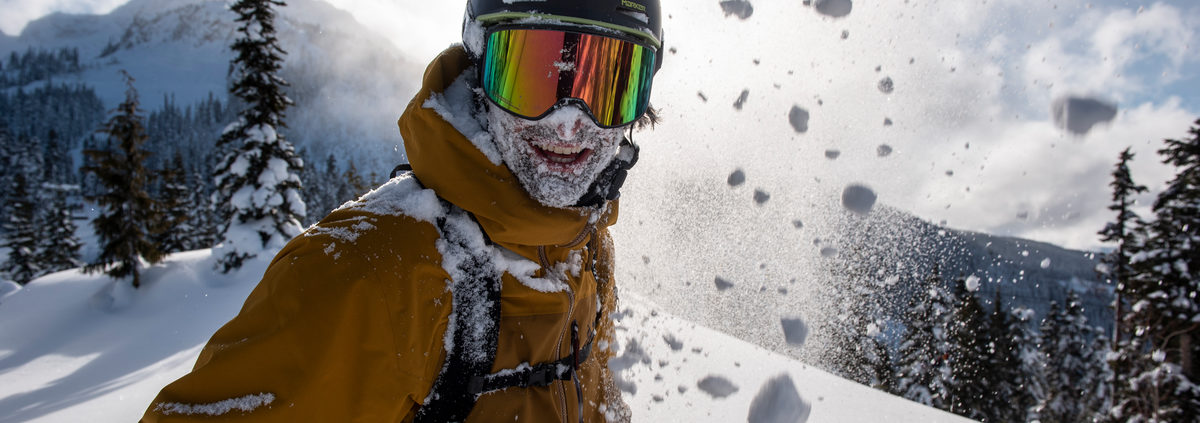 Skiier with face full of snow
