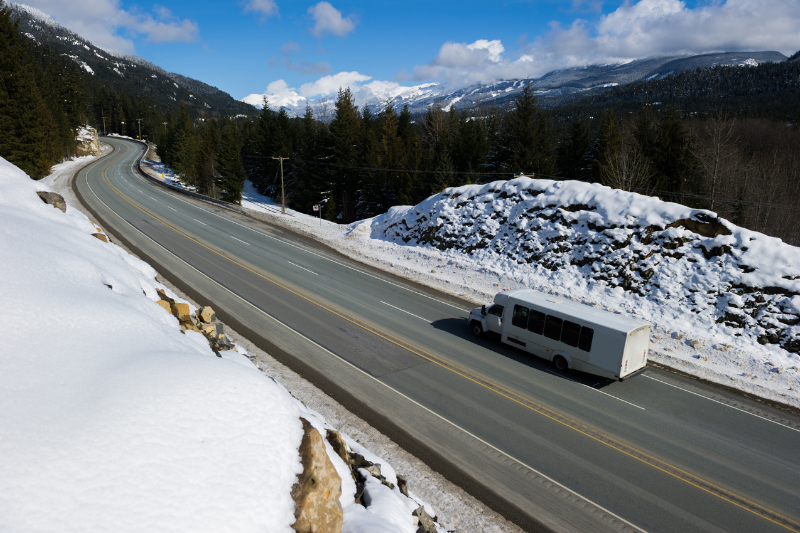 Sea to Sky Highway bus driving with snow edges